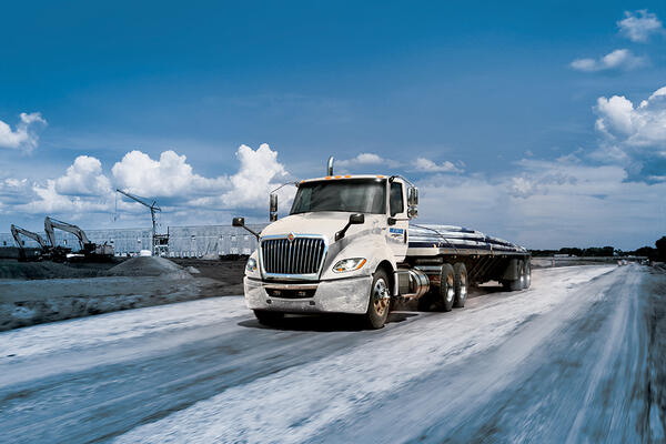 International LT Day Cab hauling Construction Materials